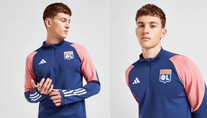 Jaqueta de Treino Olympique Lyon Adidas 2023/24 em azul marinho e rosa, representando o estilo vibrante e a qualidade premium. Apoie seu time com esta peça exclusiva da Tevo Sports, perfeita para os treinos e momentos de destaque.